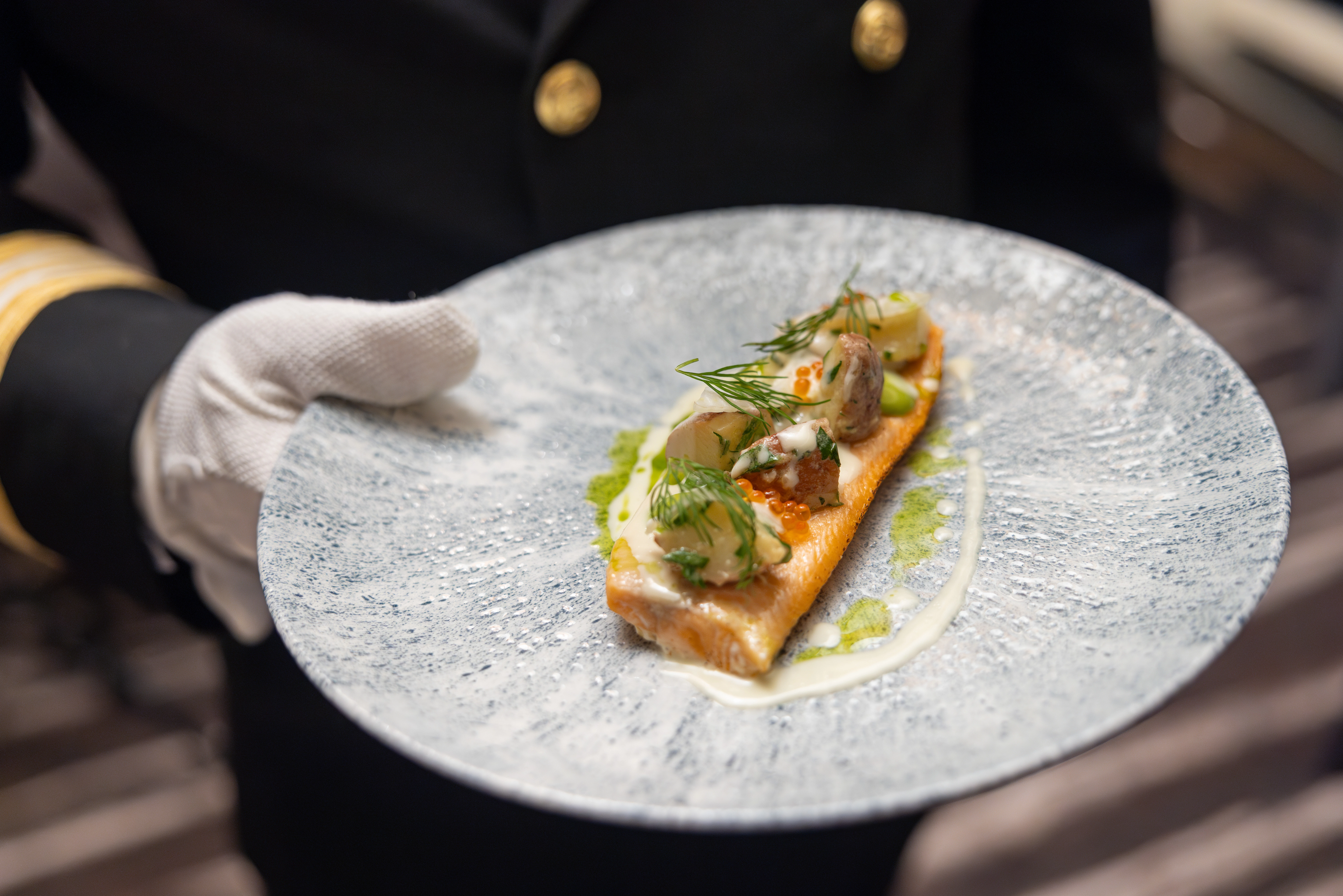 Serving delicacies for guests in restaurant Røst on board