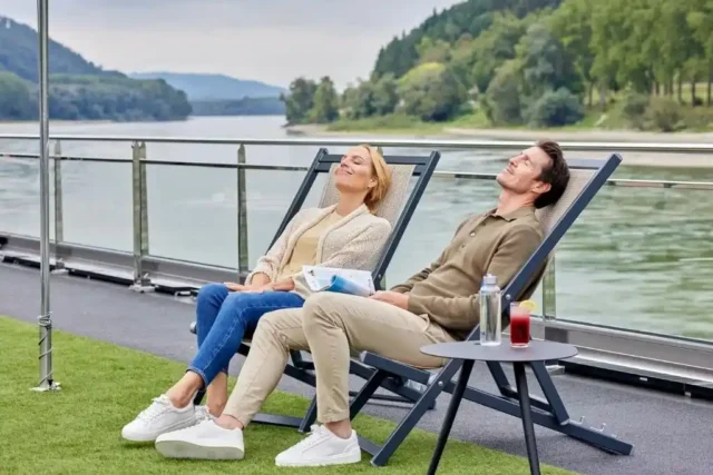 Couple standing and enjoying the sunset in VIVA Cruises
